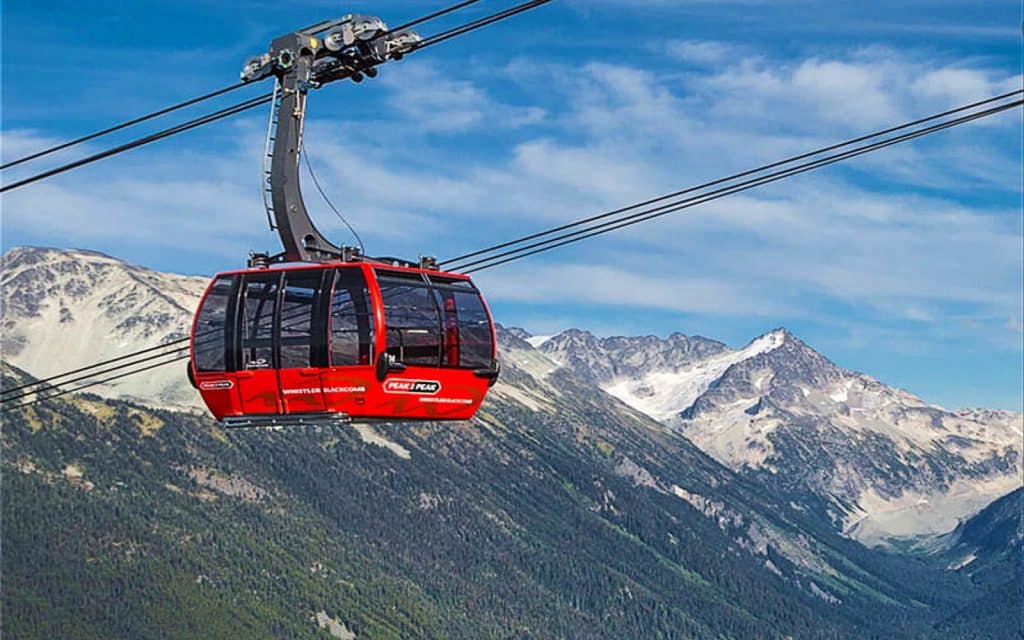 The Peak 2 Peak Gondola in front of a mountain backdrop