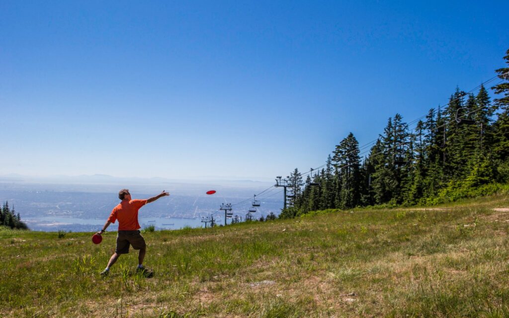 playing disc golf at Grouse Mountain in Summer