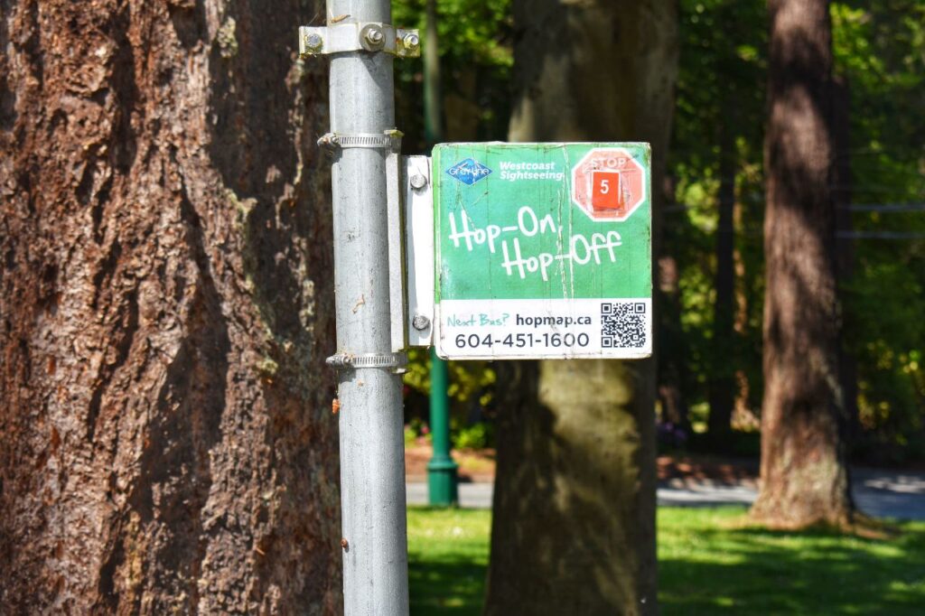 sign with a qr code for the vancouver hoho bus tour