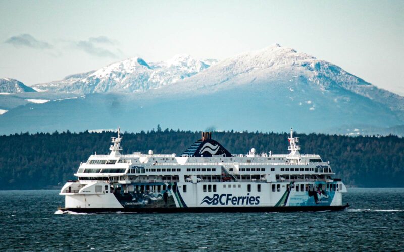 vancouver victoria ferry underway with snowy mountain backdrop