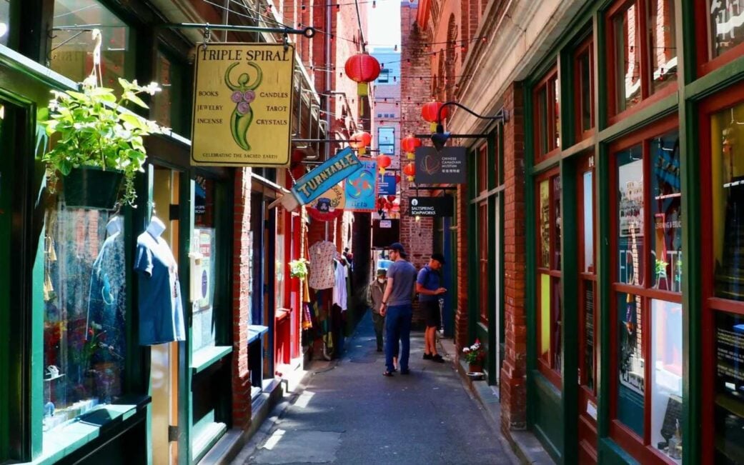 shoppers walking through fan tan alley in victoria bc