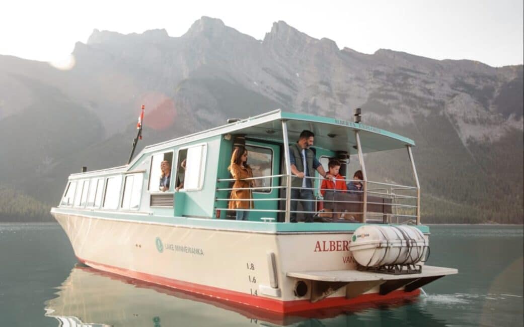 A family embarks on a Lake Minnewanka cruise, one of the top things to do in Banff.