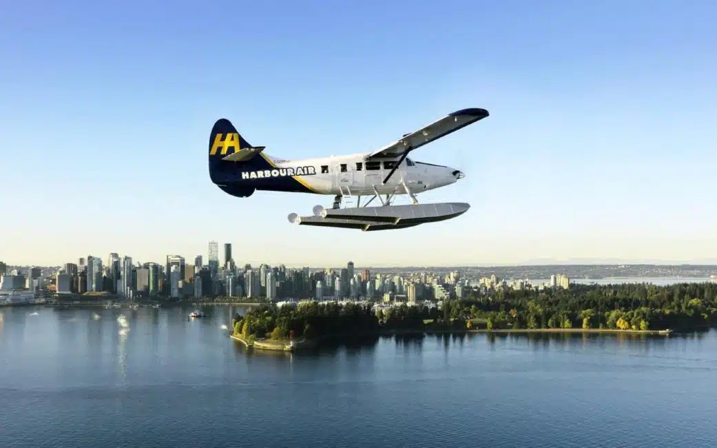The Vancouver to Nanaimo seaplane flies over Stanley Park.