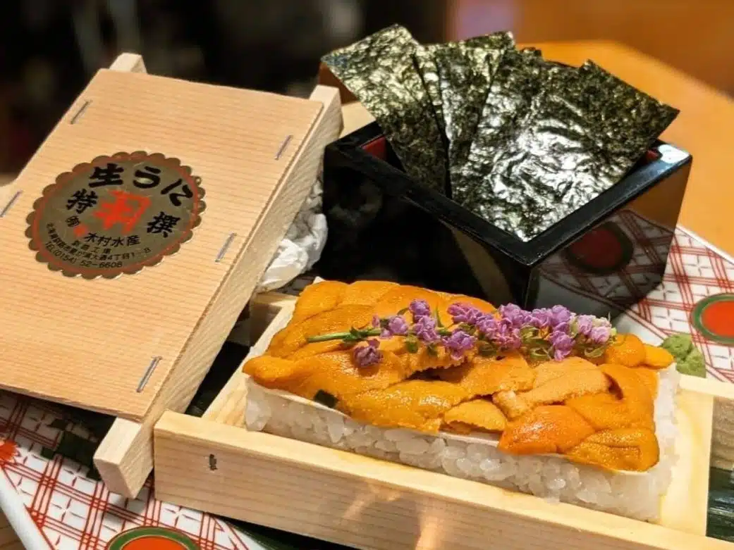 a hefty amount of uni on rice with nori on the side