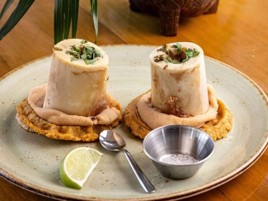 bone marrow sopes with a small salt container, a lime and spoon one of the restaurants near granville island vancouver