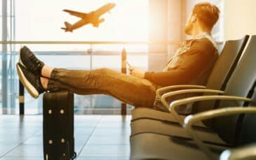 A man ponders Vancouver layover things to do in the airport.