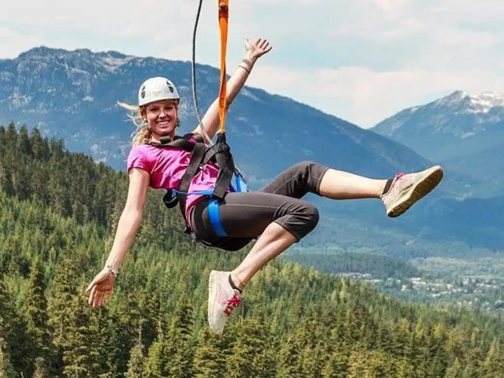 A woman enjoys the Sasquatch Zipline Experience in Whistler, BC.